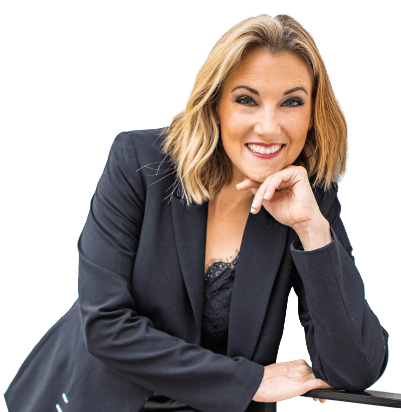 Elyssa Smith at a desk with a laptop open to her website